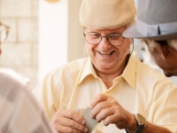 Elderly men playing cards